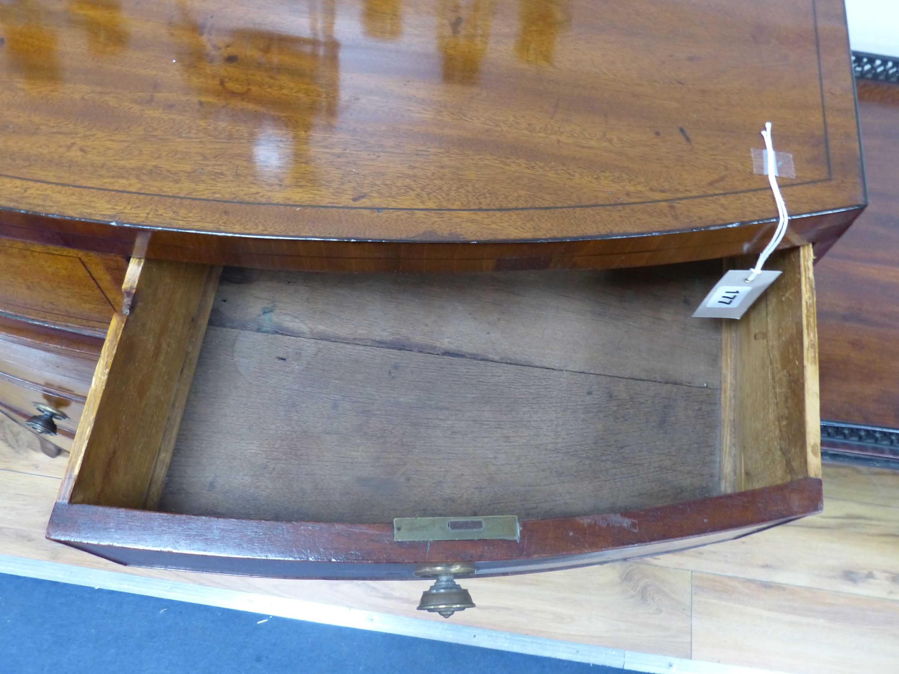 An early 19th century bow fronted mahogany chest, width 91cm, depth 50cm, height 97cm